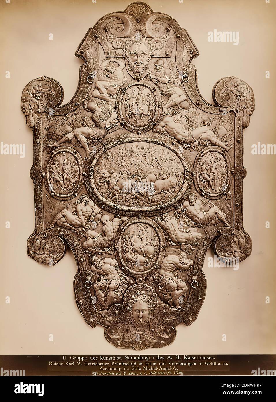 Josef Löwy, Emperor Charles V. Geared magnificent shield in iron with decorations in goldtausia. Drawing in the style of Michel-Angelo`s, albumin paper, black and white positive process, picture size: height: 28 cm; width: 21 cm, inscription: recto and: exposed into the picture: II. group of the kunsthist. Collections of the A. H. imperial family, Emperor Karl V. Geared shield in iron with decorations in goldtausia, Drawing in the style of Michel-Angelo, Photography by J. Stock Photo